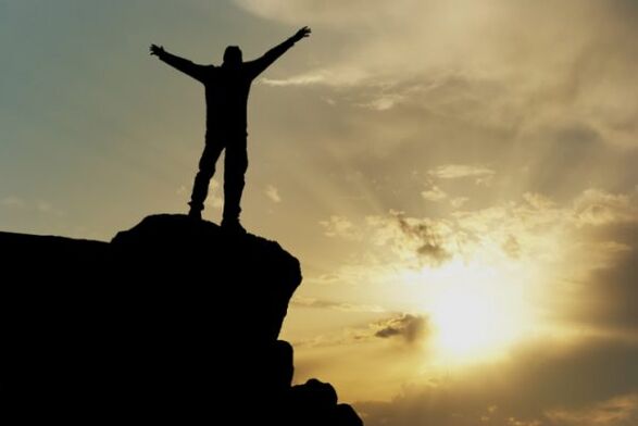 Man on the top of the mountain